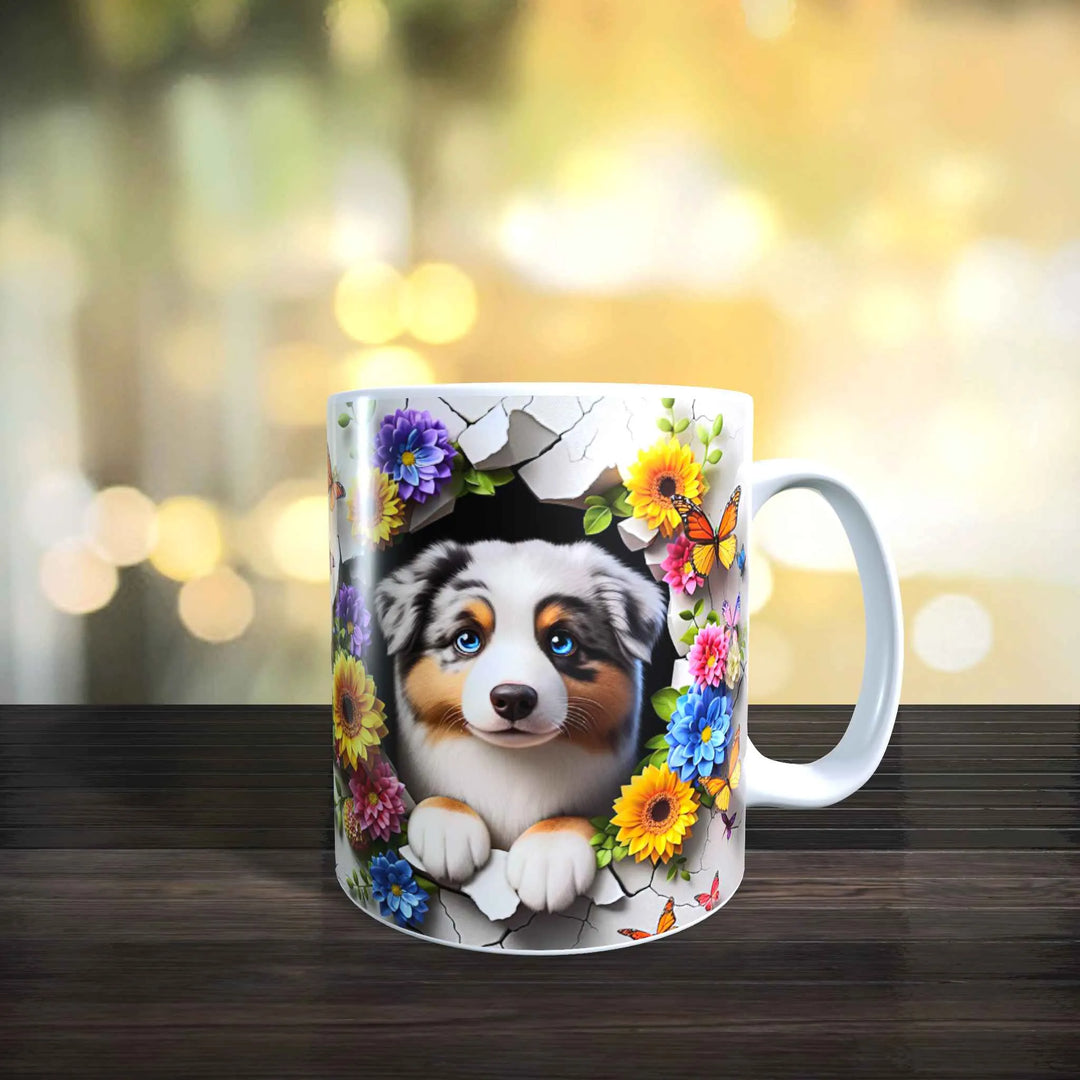Weiße Keramiktasse mit 3D-Motiv eines Australian Shepherd vor Blumen und Schmetterlingen