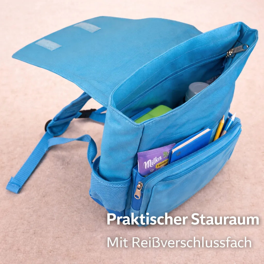 Geöffneter Kinderrucksack mit großem Innenfach und praktischem Reißverschlussfach